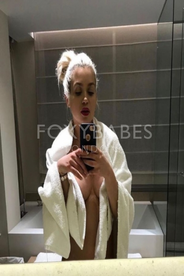 Naomi taking selfie in bathroom 